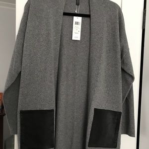 Grey cardigan with black leather pockets
